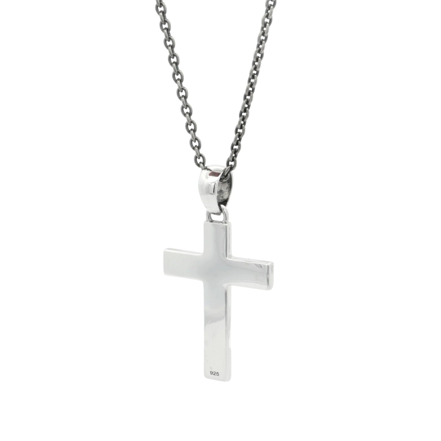 Silver cross pendant on a chain against a white background