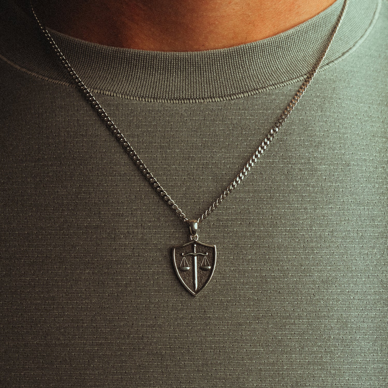Silver necklace with a shield pendant