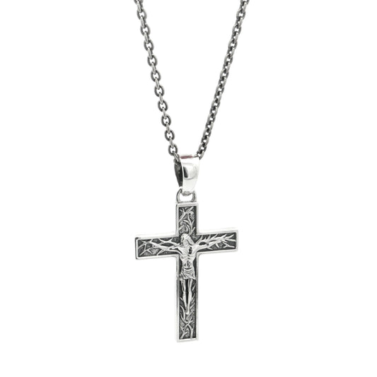 Silver crucifix cross pendant necklace on a white background